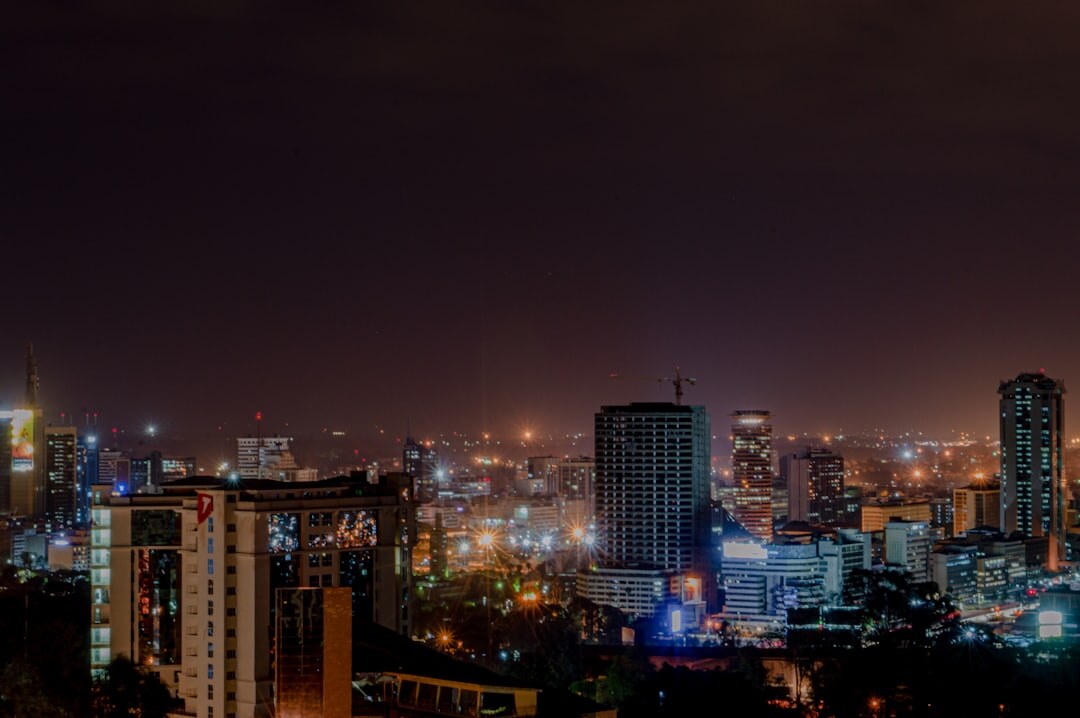 City skyline at dusk with illuminated buildings