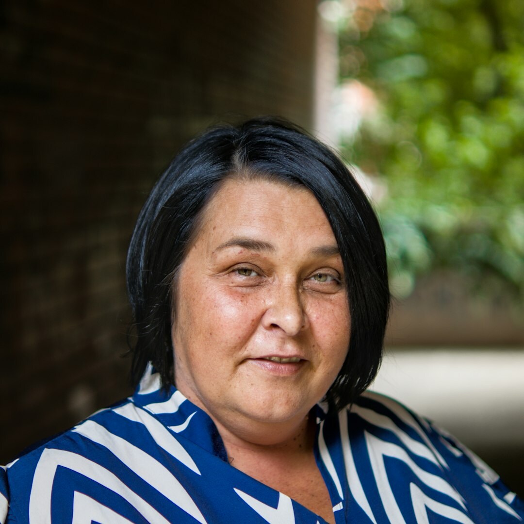 Portrait of a woman smiling professionally