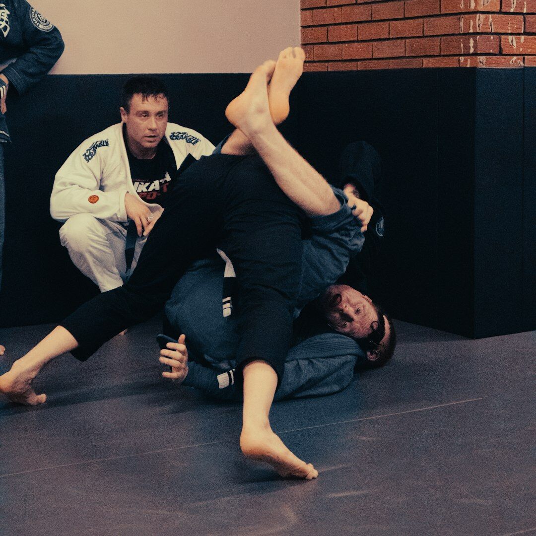 Instructor demonstrating camera framing to a trainee
